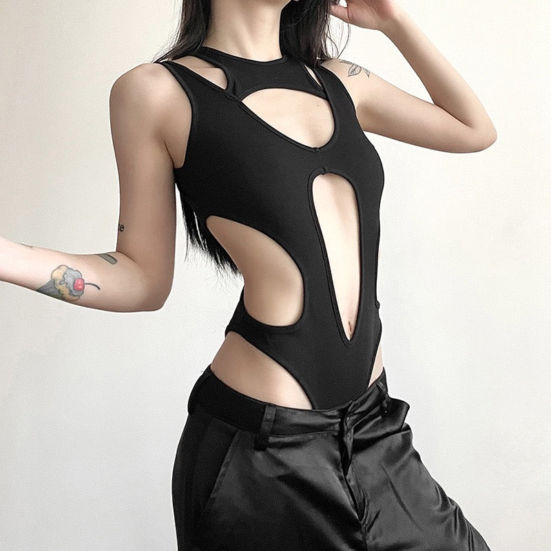 Person wearing a black exy black hollow out sleeveless bodysuit 