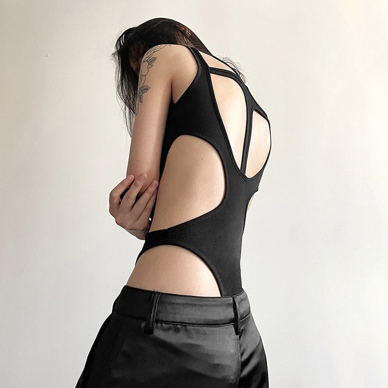 Person wearing a black sexy black hollow out sleeveless bodysuit