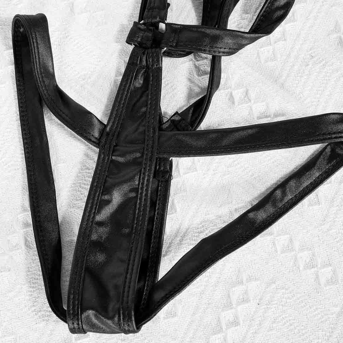 Sexy black leather body harness detail