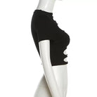 Black crop top on a white mannequin against a white background