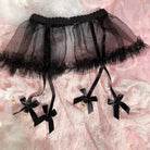 Black tulle petticoat with decorative bows on a pink floral background