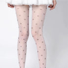 Sheer tights with paw print pattern worn by a person on a white background