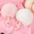 Pink and white silicone bunny tail butt plugs