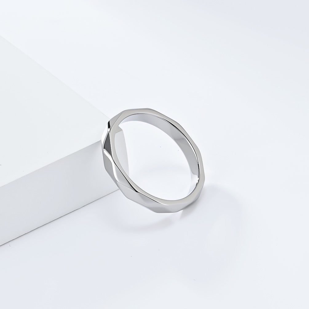 Silver minimalist rhombus stainless steel ring band on a white background