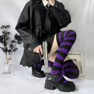 sissy in black and purple thigh high socks