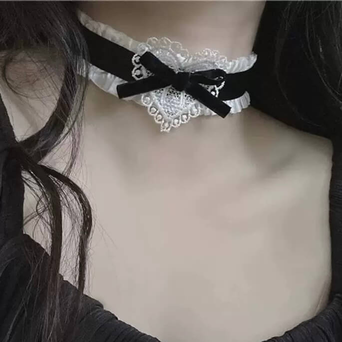 sweet lolita maid choker with a black bow on a plain background