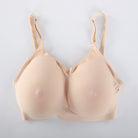 A beige seamless wireless bra with a textured, breathable mesh-like fabric, shown flat against a light gray background.