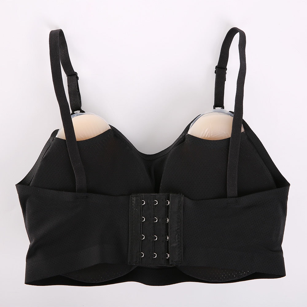 Black wireless underwire bra with adjustable shoulder straps and a central lace-up closure, displayed on a plain white background.