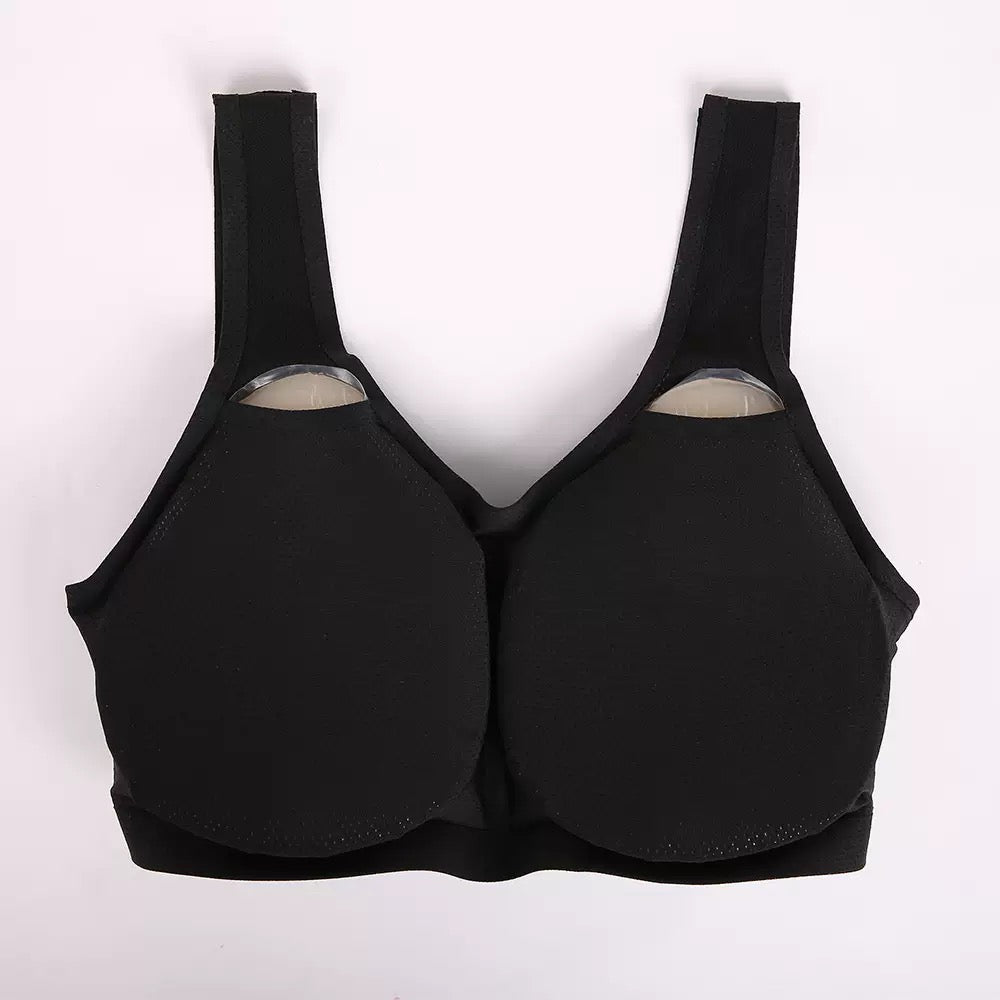 Teardrop silicone breast forms with black seamless pocketed bra cupped underside back