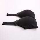 Black seamless underwire bra with wide shoulder straps, displayed on a clean white background.