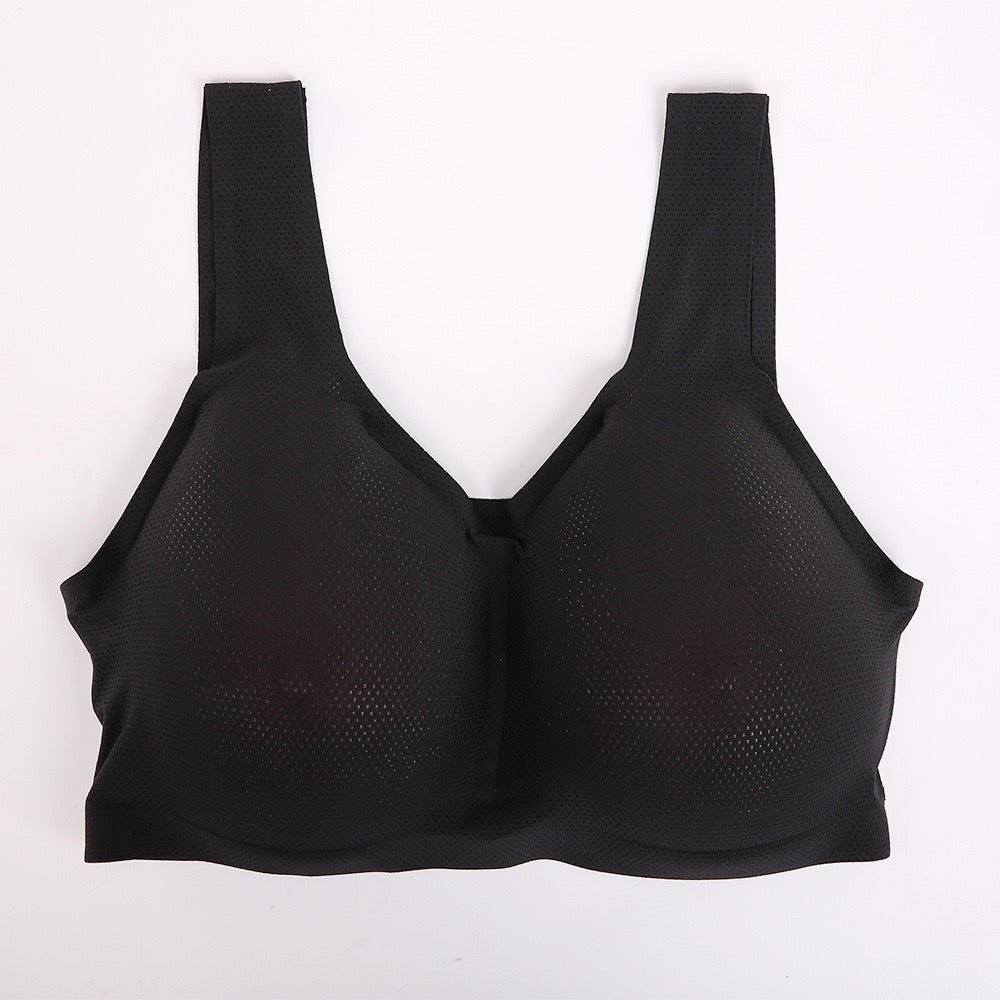 A black wireless mesh bra with wide shoulder straps, laid flat against a plain white background.