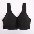 A black wireless mesh bra with wide shoulder straps, laid flat against a plain white background.