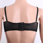 Black mesh underwire bra shown from the back on a beige mannequin torso against a white background.