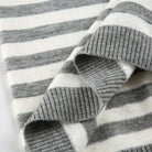 V neck gray and white striped pullover detail