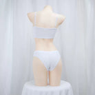 Mannequin wearing a light gray bra and panties set against a white background