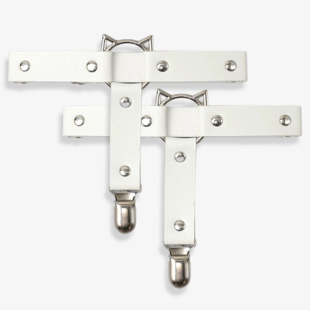 White leather leg garters with metal clasps on a white background