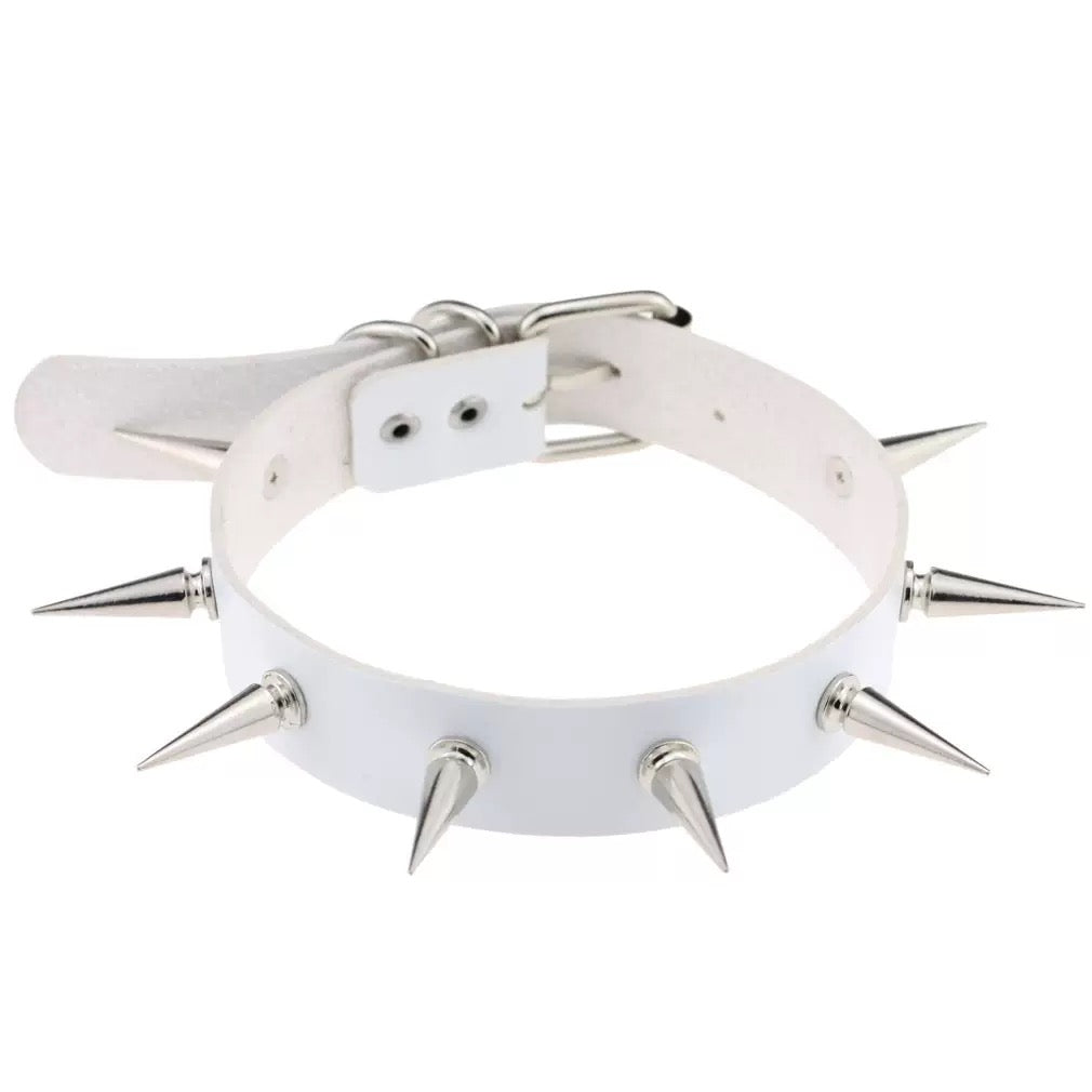 White leather collar with silver spikes on a white background