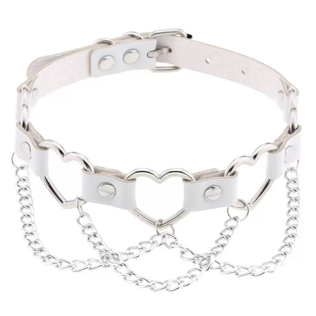 Silver chain collar with heart designs on a white background