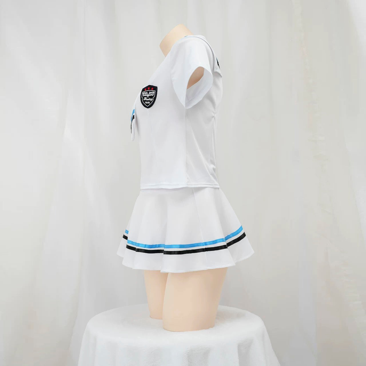 White sailor lingerie set with blue accents on a mannequin against a white background