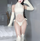 Person wearing a white ribbed knit outfit with sheer panels in a neutral setting