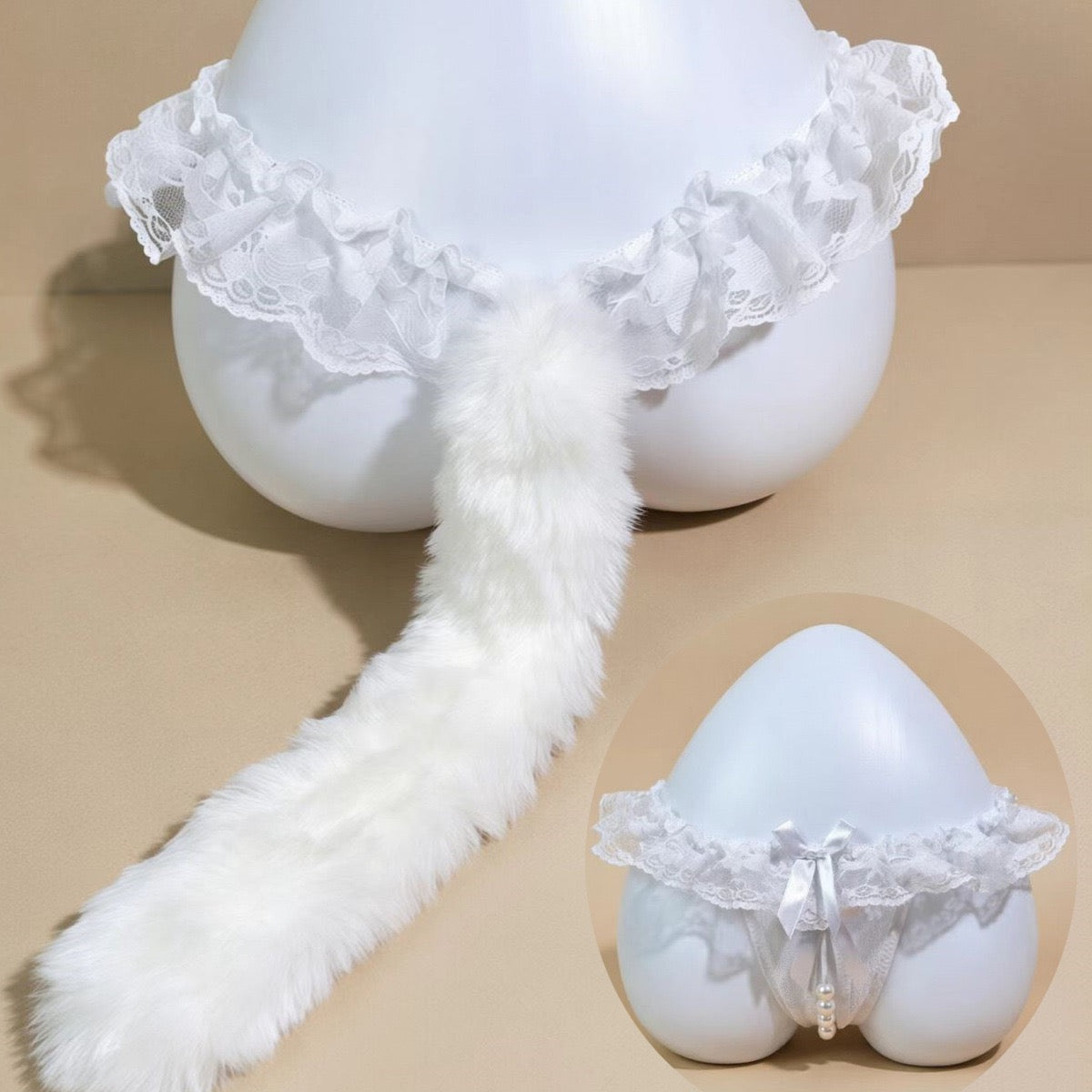 White faux-fur tail accessory with a ruffled lace waistband, displayed on a white mannequin against a beige studio background, with a circular inset showing a matching lace garter-style bottom.